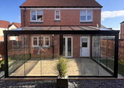 Glass veranda with sliding glass doors