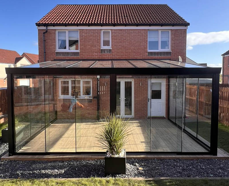 Glass veranda with sliding glass doors