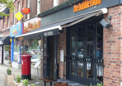 Side view of The Bubble Room restaurant awning (Cougar)
